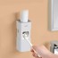 Dispensador Pasta de Dientes de pared blanco